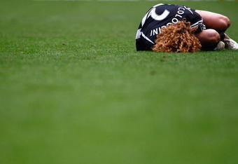 NEWCASTLE, UNITED KINGDOM - FEBRUARY 01:   Fabricio Coloccini of Newcastle United lays injured during the Barclays Premier League match between Newcastle United and Sunderland at St James Park on February, 1 2009 in Newcastle Upon Tyne, England.  (Photo by Mark Thompson/Getty Images)