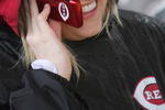 CINCINNATI, OH - APRIL 6: Shawna Bender of Cincinnati talks on her Reds phone before the opening day game between the Cincinnati Reds and the New York Mets at Great American Ballpark on April 6, 2009 in Cincinnati, Ohio. (Photo by Mark Lyons/Getty Images)