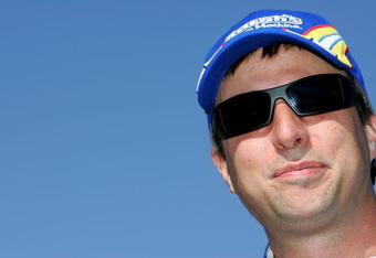 FORT WORTH, TX - APRIL 03:  David Reutimann, driver of the #00 Aaron's Dream Machine Toyota, stands on the grid during qualifying for the NASCAR Sprint Cup Series Samsung 500 at Texas Motor Speedway on April 3, 2009 in Fort Worth, Texas.  (Photo by Todd Warshaw/Getty Images)
