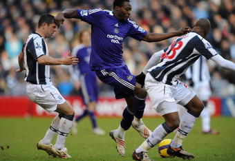 WEST BROMWICH, UNITED KINGDOM - FEBRUARY 07:  Shola Ameobi of Newcastle battles with Paul Robinson and Abdoulaye Meite of West Brom during the Barclays Premier League match between West Bromwich Albion and Newcastle United at The Hawthorns on February 7, 2009 in West Bromwich, England.  (Photo by Christopher Lee/Getty Images)