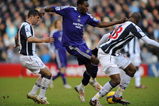 WEST BROMWICH, UNITED KINGDOM - FEBRUARY 07:  Shola Ameobi of Newcastle battles with Paul Robinson and Abdoulaye Meite of West Brom during the Barclays Premier League match between West Bromwich Albion and Newcastle United at The Hawthorns on February 7, 2009 in West Bromwich, England.  (Photo by Christopher Lee/Getty Images)