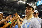 DETROIT - APRIL 06:  Tyler Hansbrough #50 of the North Carolina Tar Heels celebrates with fans as he run off the court after the Tar Heels 89-72 win against the Michigan State Spartans during the 2009 NCAA Division I Men's Basketball National Championship game at Ford Field on April 6, 2009 in Detroit, Michigan.  (Photo by Streeter Lecka/Getty Images)
