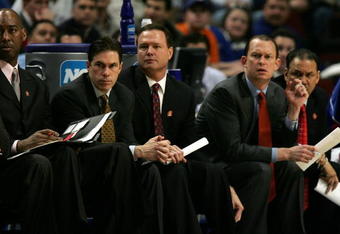CHICAGO - MARCH 16:  (L-R) Danny Manning (Dir. of Student-Athlete Dev./Manager), Tim Jankovich (assistant coach), Head coach Bill Self, Joe Dooley (assitant coach) and Kurtis Townsend (assitant coach) of the Kansas Jayhawks watch the action from the bench against the Niagara Purple Eagles during the first round of the NCAA Men's Basketball Tournament at the United Center March 16, 2007 in Chicago, Illinois. Kansas won 107-67. (Photo by Jonathan Daniel/Getty Images)