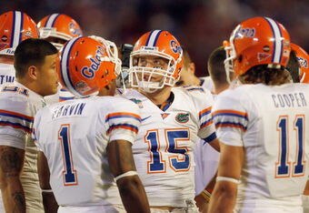 MIAMI - JANUARY 08:  Quarterback Tim Tebow #15 of the Florida Gators huddles against the Oklahoma Sooners during the FedEx BCS National Championship Game at Dolphin Stadium on January 8, 2009 in Miami, Florida.  (Photo by Eliot J. Schechter/Getty Images