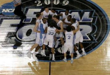 DETROIT - APRIL 06:  Tyler Hansbrough #50 of the North Carolina Tar Heels celebrates with his teammates as the Michigan State Spartans leave the court after losing to the Tar Heels 89-72 during the 2009 NCAA Division I Men's Basketball National Championship game at Ford Field on April 6, 2009 in Detroit, Michigan.  (Photo by Streeter Lecka/Getty Images)