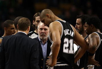 BOSTON - FEBRUARY 08:  Head coach Gregg Popovich of the San Antonio Spurs talks with his players during a time out against the Boston Celtics on February 8, 2009 at TD Banknorth Garden in Boston, Massachusetts. The Spurs defeated the Celtics 105-99. NOTE TO USER: User expressly acknowledges and agrees that, by downloading and or using this Photograph, user is consenting to the terms and conditions of the Getty Images License Agreement.  (Photo by Elsa/Getty Images)