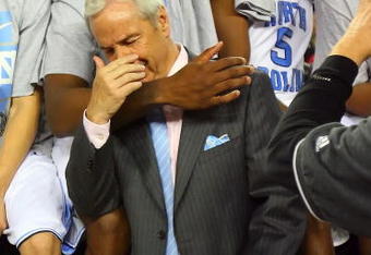 DETROIT - APRIL 06:  Deon Thompson #21 and head coach Roy Williams of the North Carolina Tar Heels celebrates after defeating the Michigan State Spartans 89-72 during the 2009 NCAA Division I Men's Basketball National Championship game at Ford Field on April 6, 2009 in Detroit, Michigan.  (Photo by Streeter Lecka/Getty Images)
