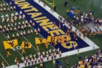 Wvu_football_on_to_the_field_crop_150x100