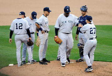 BALTIMORE - APRIL 06:  C.C. Sabathia #52 of the New York Yankees hand the ball to manager Joe Girardi in the fifth inning against the Baltimore Orioles during opening day on April 6, 2009 at Camden Yards in Baltimore, Maryland.  (Photo by Greg Fiume/Getty Images)