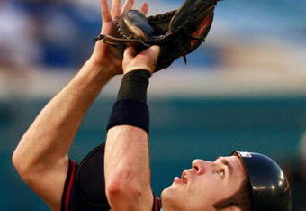 MIAMI - JUNE 22:  Catcher Joe Mauer #7 of the Minnesota Twins waits to catch a pop-up behind home plate against the Florida Marlins during interleague play at Dolphin Stadium on June 22, 2007 in Miami, Florida. The Marlins defeated the Twins 5-4.  (Photo by Doug Benc/Getty Images)