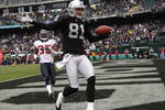OAKLAND, CA - DECEMBER 21: Chaz Schilens #81 of the Oakland Raiders celebrates scoring a touchdown past Jacques Reeves #35 of the Houston Texans during an NFL game on December 21, 2008 at the Oakland-Alameda County Coliseum in Oakland, California.  (Photo by Jed Jacobsohn/Getty Images)