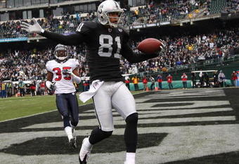 OAKLAND, CA - DECEMBER 21: Chaz Schilens #81 of the Oakland Raiders celebrates scoring a touchdown past Jacques Reeves #35 of the Houston Texans during an NFL game on December 21, 2008 at the Oakland-Alameda County Coliseum in Oakland, California.  (Photo by Jed Jacobsohn/Getty Images)