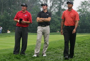 MEDINAH, IL - AUGUST 18:  Phil Mickelson, Geoff Ogilvy of Australia and Tiger Woods wait in the 15th fairway for the group ahead to finish on the 15th green during the second round of the 2006 PGA Championship at Medinah Country Club on August 18, 2006 in Medinah, Illinois.  (Photo by Jeff Gross/Getty Images)