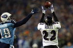 NASHVILLE, TN - JANUARY 10:  Cornerback Samari Rolle #22 of the Baltimore Ravens intercepts a pass alongside wide receiver Justin McCareins #19 of the Tennessee Titans in the second quarter during the AFC Divisional Playoff Game on January 10, 2009 at LP Field in Nashville, Tennessee.  (Photo by Jonathan Daniel/Getty Images)