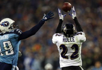 NASHVILLE, TN - JANUARY 10:  Cornerback Samari Rolle #22 of the Baltimore Ravens intercepts a pass alongside wide receiver Justin McCareins #19 of the Tennessee Titans in the second quarter during the AFC Divisional Playoff Game on January 10, 2009 at LP Field in Nashville, Tennessee.  (Photo by Jonathan Daniel/Getty Images)