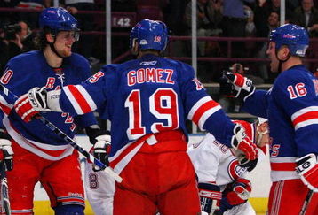 NEW YORK - APRIL 07:  Nik Antropov #80 of the New York Rangers celebrates his second period goal against the Montreal Canadiens with teammates Scott Gomez #19 and Sean Avery #16 on April 7, 2009 at Madison Square Garden in New York City.  (Photo by Jim McIsaac/Getty Images)