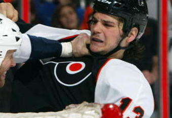 PHILADELPHIA - MARCH 07:  Greg de Vries #7 of the Nashville Predators throws a punch against Dan Carcillo #13 of the Philadelphia Flyers on March 7, 2009 at Wachovia Center in Philadelphia, Pennsylvania.  (Photo by Jim McIsaac/Getty Images)