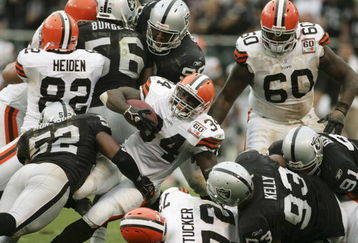OAKLAND, CA - OCTOBER 01:  Reuben Droughns #34 of the Cleveland Browns is tackled by Kirk Morrison #52 of the Oakland Raiders October 1, 2006 at McAfee Coliseum in Oakland, California.  (Photo by Jonathan Ferrey/Getty Images)