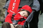 SHANGHAI, CHINA - NOVEMBER 09:  A young golf fan sleeps during the forth round of the HSBC Champions at Sheshan Golf Club on November 9, 2008 in Shanghai, China.  (Photo by Ross Kinnaird/Getty Images)