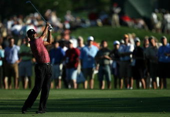 ORLANDO, FL - MARCH 29:  Tiger Woods hits out of the fairway on the 12th hole during the final round of the Arnold Palmer Invitational Presented by Mastercard at the Bay Hill Club and Lodge on March 29, 2009 in Orlando, Florida   (Photo by Doug Benc/Getty Images)