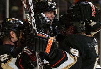 ANAHEIM, CA - MARCH 11:  (L-R) Todd Marchant #22, Scott Niedermayer #27, Chris Pronger #25 and Bobby Ryan #9 of the Anaheim Ducks celebrate Niedermayer's game-winning overtime goal after the NHL game against the Vancouver Canucks at Honda Center on March 11, 2009 in Anaheim, California. The Ducks defeated the Canucks 4-3 in overtime.  (Photo by Victor Decolongon/Getty Images)