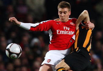 LONDON - MARCH 17:  Nicklas Bendtner of Arsenal challenges Ian Ashbee of Hull City during the the FA Cup Sponsored by E.on sixth round match between Arsenal and Hull City at Emirates Stadium on March 17, 2009 in London, England.  (Photo by Ryan Pierse/Getty Images)