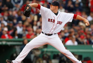BOSTON - OCTOBER 13:  Starting pitcher Jon Lester #31 of the Boston Red Sox delivers a pitch against the Tampa Bay Rays in game three of the American League Championship Series during the 2008 MLB playoffs at Fenway Park on October 13, 2008 in Boston, Massachusetts.  (Photo by Jim Rogash/Getty Images)