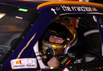 FORT WORTH, TX - APRIL 04:  David Reutimann, driver of the #00 Aaron's Dream Machine Toyota, sits in his car during practice for the NASCAR Sprint Cup Series Samsung 500 at Texas Motor Speedway on April 4, 2009 in Fort Worth, Texas.  (Photo by Tom Pennington/Getty Images for NASCAR)
