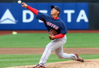 NEW YORK - APRIL 04:  Daisuke Matsuzaka #18 of the Boston Red Sox throws a pitch against the New York Mets on April 4, 2009 at Citi Field in the Flushing neighborhood of the Queens borough of New York City.  (Photo by Jim McIsaac/Getty Images)