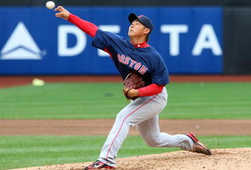 NEW YORK - APRIL 04:  Daisuke Matsuzaka #18 of the Boston Red Sox throws a pitch against the New York Mets on April 4, 2009 at Citi Field in the Flushing neighborhood of the Queens borough of New York City.  (Photo by Jim McIsaac/Getty Images)