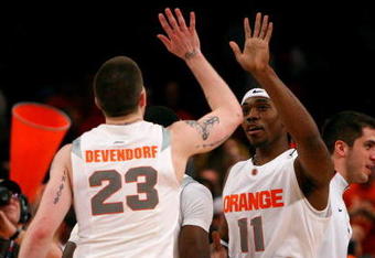 NEW YORK - MARCH 13: Eric Devendorf #23 and Paul Harris #11 of the Syracuse Orange react late in the game against the West Virginia Mountaineers during the semifinal round of the Big East Tournament at Madison Square Garden on March 13, 2009 in New York City.  (Photo by Jim McIsaac/Getty Images)