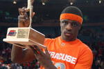NEW YORK - MARCH 14:  Jonny Flynn #10 of the Syracuse Orange poses with his trophy after the championship game of the Big East Tournament against the Louisville Cardinals at Madison Square Garden on March 14, 2009 in New York City.  (Photo by Jim McIsaac/Getty Images)