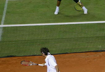 MALLORCA, SPAIN - MAY 2: Rafael Nadal of Spain in action against Roger Federer of Switzerland during 'The Battle of the Surfaces' at The Palma Arena on May 2, 2007 in Mallorca, Spain. (Photo by Clive Brunskill/Getty Images)