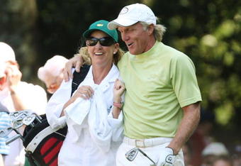 AUGUSTA, GA - APRIL 08:  Greg Norman of Australia celebrates his hole-in-one on the sixth hole with his wife/caddie Chris Evert during the Par 3 Contest prior to the 2009 Masters Tournament at Augusta National Golf Club on April 8, 2009 in Augusta, Georgia.  (Photo by David Cannon/Getty Images)