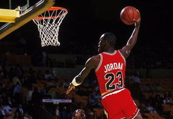 Michael Jordan #23 of the Chicago Bulls dunks the ball during a game against the Los Angeles Lakers.
