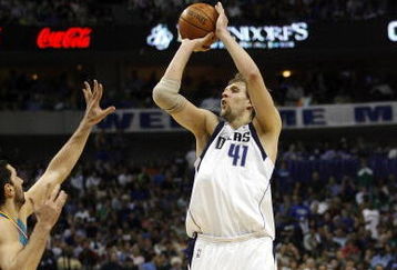 DALLAS - APRIL 25:  Dirk Nowitzki #41 of the Dallas Mavericks shoots over Peja Stojakovic #16 the New Orleans Hornets in Game Three of the Western Conference Quarterfinals during the 2008 NBA Playoffs at the American Airlines Center on April 25, 2008 in Dallas, Texas. Nowitzki had 32 points as the Mavericks won 97-87  (Photo by Layne Murdoch/Getty Images)