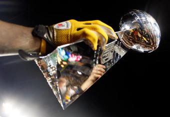 TAMPA, FL - FEBRUARY 01:  Players from the Pittsburgh Steelers celebrate with the Vince Lombardi trophy after their 27-23 win against the Arizona Cardinals during Super Bowl XLIII on February 1, 2009 at Raymond James Stadium in Tampa, Florida.  (Photo by Jamie Squire/Getty Images)