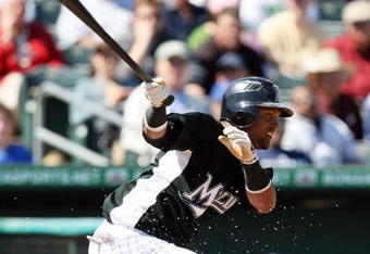 JUPITER, FL - MARCH 3:  Emilio Bonifacio #1 of Florida Marlins makes contact against the Dominican Republic during an exhibition game at Roger Dean Stadium March 3, 2009 in Jupiter, Florida.  (Photo by Doug Benc/Getty Images)