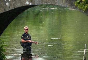 LIMERICK, IRELAND - MAY 16:  Jamie Donaldson of Wales trys his hand at fishing after the second round of the Irish Open on May 16, 2008 at the Adare Manor Hotel and Golf Resort in Limerick, Ireland.  (Photo by Andrew Redington/Getty Images)