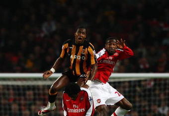 LONDON - MARCH 17:  Manucho of Hull city jumps for the ball with Johan Djourou of Arsenal during the the FA Cup Sponsored by E.on sixth round match between Arsenal and Hull City at Emirates Stadium on March 17, 2009 in London, England.  (Photo by Ryan Pierse/Getty Images)