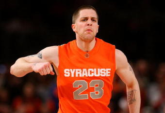 NEW YORK - MARCH 14:  Eric Devendorf #23 of the Syracuse Orange reacts between plays against the Louisville Cardinals during the championship game of the Big East Tournament at Madison Square Garden on March 14, 2009 in New York City.  (Photo by Jim McIsaac/Getty Images)