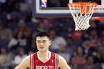 CHARLOTTE, NC - MARCH 13:  Yao Ming #11 of the Houston Rockets rests oncourt against the Charlotte Bobcats during their game at Time Warner Cable Arena on March 13, 2009 in Charlotte, North Carolina.  NOTE TO USER: User expressly acknowledges and agrees that, by downloading and/or using this Photograph, user is consenting to the terms and conditions of the Getty Images License Agreement. (Photo by: Streeter Lecka/Getty Images)