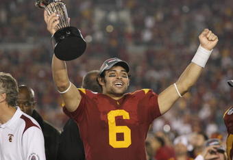 PASADENA, CA - JANUARY 1:  Mark Sanchez #6 of the USC Trojans rejoices as he holds the Rose Bowl Trophy after the game against the Penn State Nittany Lions on January 1, 2009 at the Rose Bowl in Pasadena, California.  USC won 38-24.  (Photo by Jeff Golden/Getty Images)