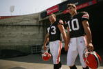 LOS ANGELES, CA - MAY 19: (R-L) Quarterback, Brady Quinn #10 of the Cleveland Browns walks to the field with team mate, offensive tackle, Joe Thomas #73 at the 2007 NFL Players Rookie Premiere on May 19, 2007 at the Los Angeles Memorial Coliseum in Los Angeles, California. (Photo by Nick Laham/Getty Images) 
