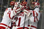 WASHINGTON - APRIL 9:  Colin Wilson #33 of the Boston Terriers is congratulated after he scored the game-winning goal against the Vermont Catamounts during the NCAA Men's Frozen Four Semifinal game at the Verizon Center April 9, 2009 in Washington, DC. The Boston Terriers defeated the Vermont Catamounts 5-4.  (Photo by Elsa/Getty Images)