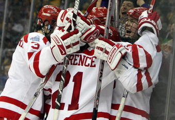 WASHINGTON - APRIL 9:  Colin Wilson #33 of the Boston Terriers is congratulated after he scored the game-winning goal against the Vermont Catamounts during the NCAA Men's Frozen Four Semifinal game at the Verizon Center April 9, 2009 in Washington, DC. The Boston Terriers defeated the Vermont Catamounts 5-4.  (Photo by Elsa/Getty Images)