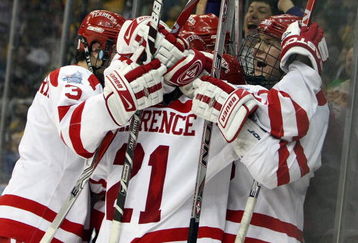 WASHINGTON - APRIL 9:  Colin Wilson #33 of the Boston Terriers is congratulated after he scored the game-winning goal against the Vermont Catamounts during the NCAA Men's Frozen Four Semifinal game at the Verizon Center April 9, 2009 in Washington, DC. The Boston Terriers defeated the Vermont Catamounts 5-4.  (Photo by Elsa/Getty Images)