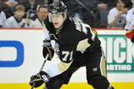 PITTSBURGH - MARCH 25:  Forward Evgeni Malkin #71 of the Pittsburgh Penguins skates with the puck against the Calgary Flames on March 25, 2009 at Mellon Arena in Pittsburgh, Pennsylvania.  (Photo by Jamie Sabau/Getty Images)