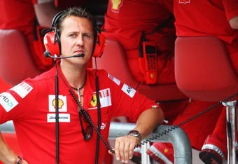 KUALA LUMPUR, MALAYSIA - APRIL 04:  Former Ferrari Formula One World Champion Michael Schumacher of Germany is seen on the Ferrari pitwall before qualifying for the Malaysian Formula One Grand Prix at the Sepang Circuit on April 4, 2009 in Kuala Lumpur, Malaysia.  (Photo by Clive Mason/Getty Images)