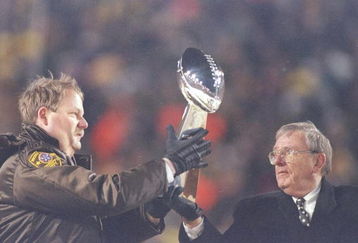 27 Jan 1997:  Green Bay Packers Coach Mike Holmgren (left) and General Manager Ron Wolf hold the trophy during the celebration at Lambeau Field in Green Bay, Wisconsin. Mandatory Credit: Matthew Stockman  /Allsport